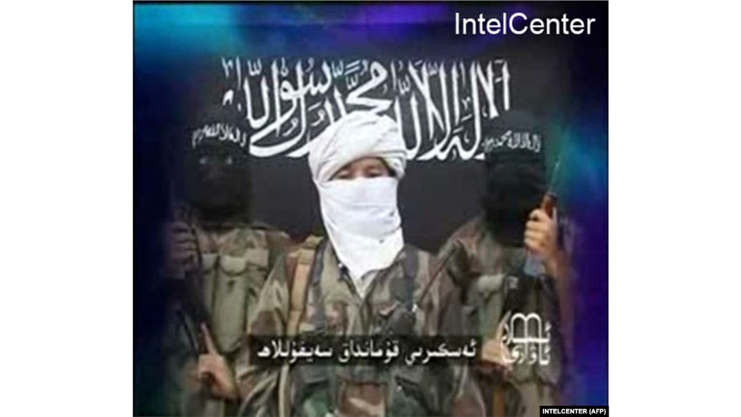 An image taken from a 2008 video released by the Turkestan Islamic Party and obtained from the IntelCenter features a statement threatening the Olympic Games that year in Beijing.