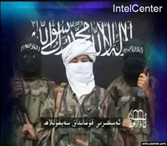 An image taken from a 2008 video released by the Turkestan Islamic Party and obtained from the IntelCenter features a statement threatening the Olympic Games that year in Beijing.