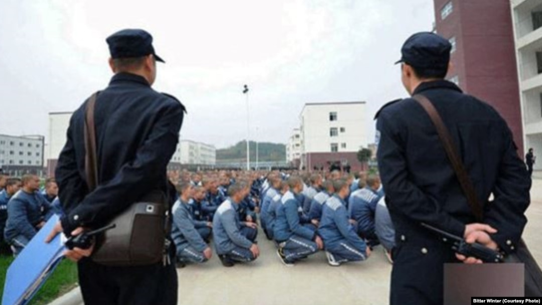 Guards monitor Uyghur inmates at a reeducation camp in northwestern China's Xinjiang region. (file photo)