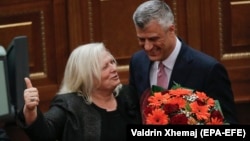 President Hashim Thaci (right) sidestepped questions about the display of the image by Flora Brovina (left).