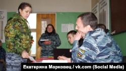 Police Captain Oksana Semykina (left) is no political dissident, just someone who argued with her boss.