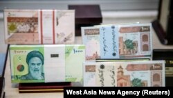 Iranian currency at an exchange shop in Tehran on August 1