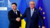 Ukrainian President Volodymyr Zelenskiy poses with European Commission President Jean-Claude Juncker at the EU Commission headquarters in Brussels on June 4.