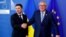 Ukrainian President Volodymyr Zelenskiy poses with European Commission President Jean-Claude Juncker at the EU Commission headquarters in Brussels on June 4.