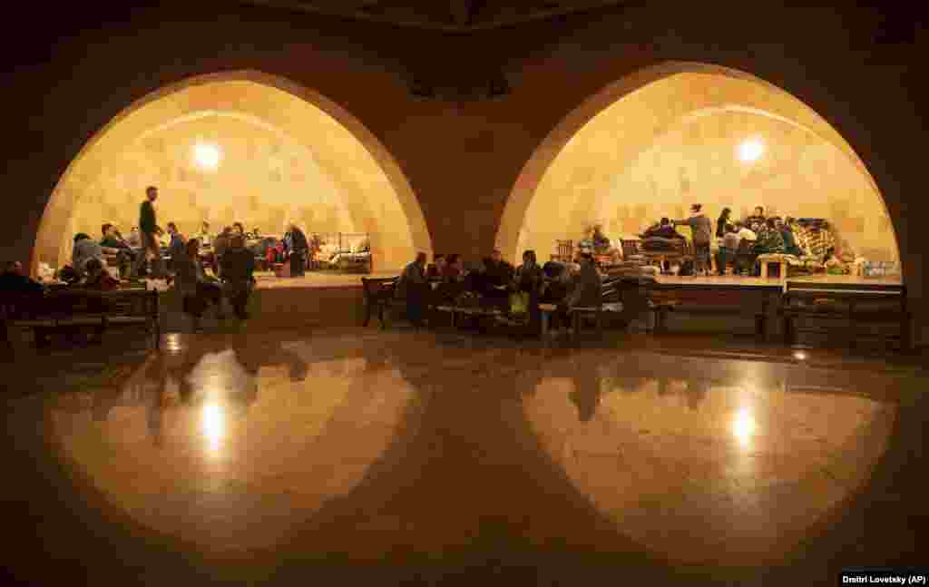 People take refuge in a bomb shelter in Stepanakert (Xankandi), the main city of the breakaway region Nagorno-Karabakh, on October 6. (AP/Dmitry Lovetsky)