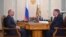 Russian President Vladimir Putin (left) and Russia's Supreme Court Chairman Vyacheslav Lebedev at a meeting the Kremlin says took place on March 13.