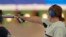 Nino Salukvadze competes in the 10-meter women's air pistol event at her final Olympic Games in Paris on July 27. 