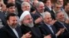 IRAN -- A handout picture provided by the office of Iranian President Hassan Rohani on October 14, 2018 shows him (Second Left) attending a ceremony at Tehran University marking the beginning of the new Iranian academic year. 