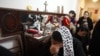 A Coptic Orthodox Christian cries for her relatives who were victims of the January 1 bomb attacks outside a Coptic church in Alexandria.