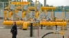 Moldova -- An official walks near a pumping station during the inauguration ceremony of the Iasi-Ungheni Moldovan-Romanian gas pipeline, in Zagarancea village, Ungheni district, 124 kms North-West of Chisinau, August 27, 2014