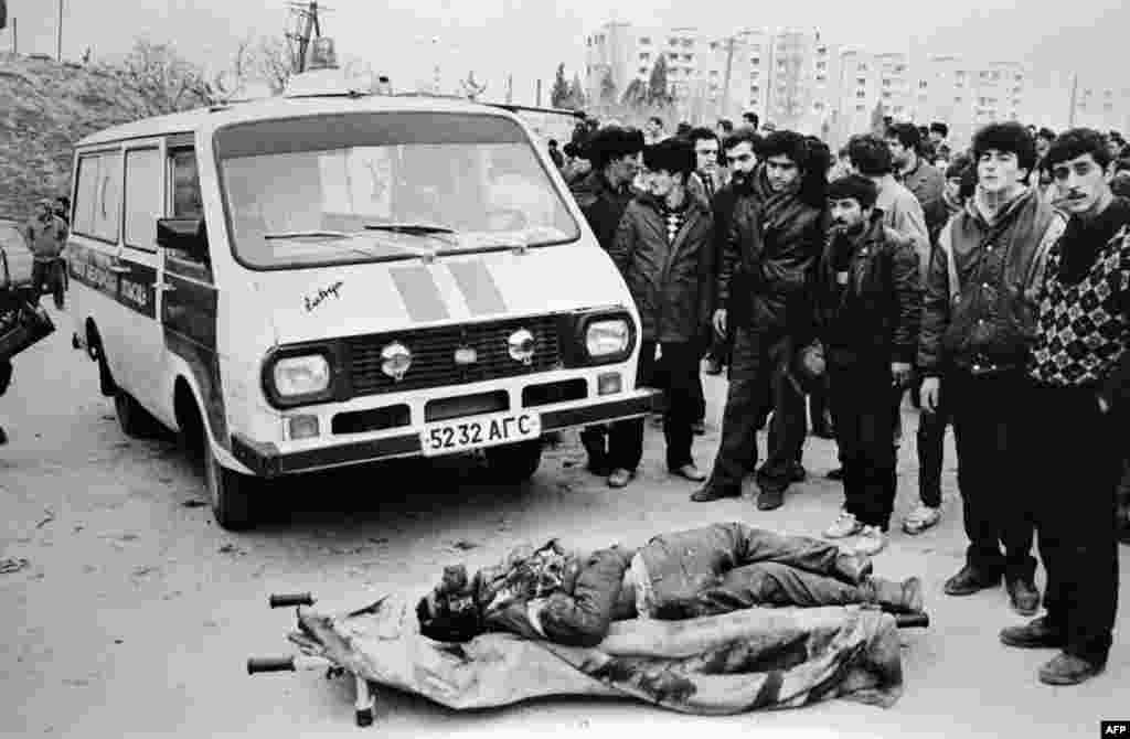 Azerbaijanis surround a victim of the Soviet crackdown in Baku starting on January 20,1990. Over several days, more than 200 people were killed and at least 700 were wounded as Soviet troops fired without warning into crowds of protesters. Ordinary citizens were targeted. The dead included Azerbaijanis, Tatars, Armenians, Russians, Jews, and Lezgins, a northeast Caucasian ethnic group.
