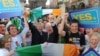 Former President of the EU Parliament Pat Cox (center-left) celebrates a "yes" vote in the Lisbon Treaty referendum in Dubin.