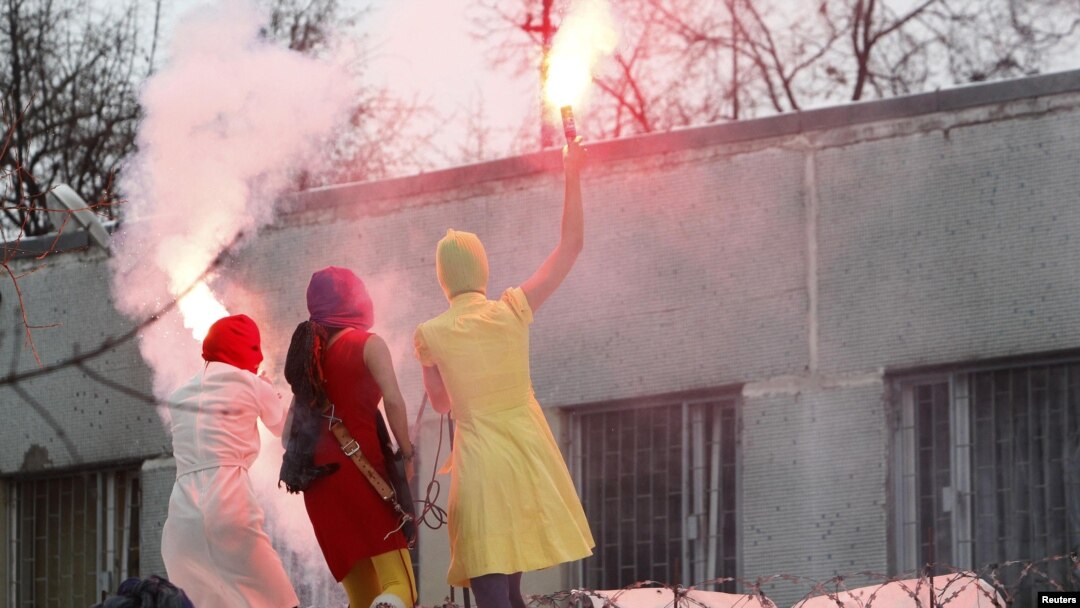Members of the radical feminist group Pussy Riot performing in support of detained opposition activists in December. 