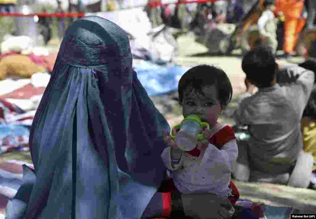 An Afghan woman and child in a Kabul public park.