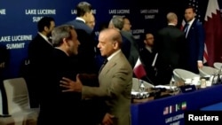 Pakistani Prime Minister Shehbaz Sharif (right) welcomes Iranian Foreign Minister Abbas Araqchi, as US Vice President JD Vance stands in the background, before the start of peace talks in Switzerland on June 21. 