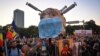 People take part in a protest against anti COVID-19 restrictions and vaccinations in Bucharest on October 2.