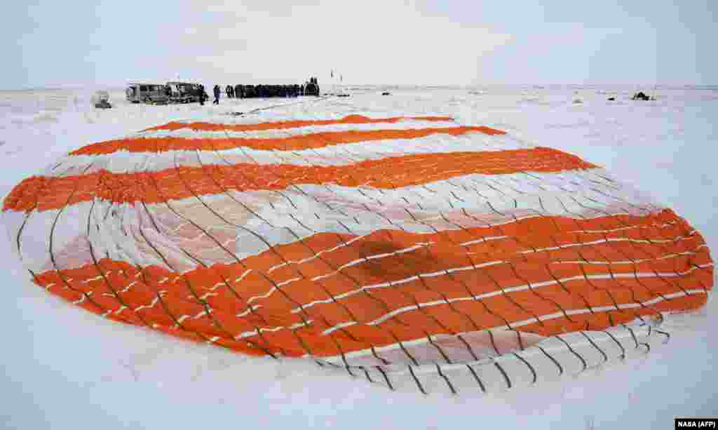 The parachute of the Soyuz MS-09 spacecraft shortly after the capsule landed with Expedition 57 crew members in a remote area of Kazakhstan on December 20, 2018. Three astronauts landed back on Earth after a troubled stint on the ISS marred by an air leak and the failure of a rocket set to bring new crew members. (AFP/NASA/Bill Ingalls)