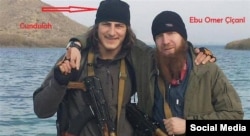 The Georgian ethnic Kist said to have been killed near Kobani, posing with Umar al-Shishani (right).