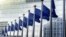 EU flags in front of European Commission in Brussels - generic