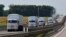 The Russian convoy of trucks carrying aid heads toward Ukraine.