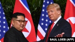 La întîlnirea dintre Donald Trump și Kim Jong Un în Singapore, 12 iunie 2018.