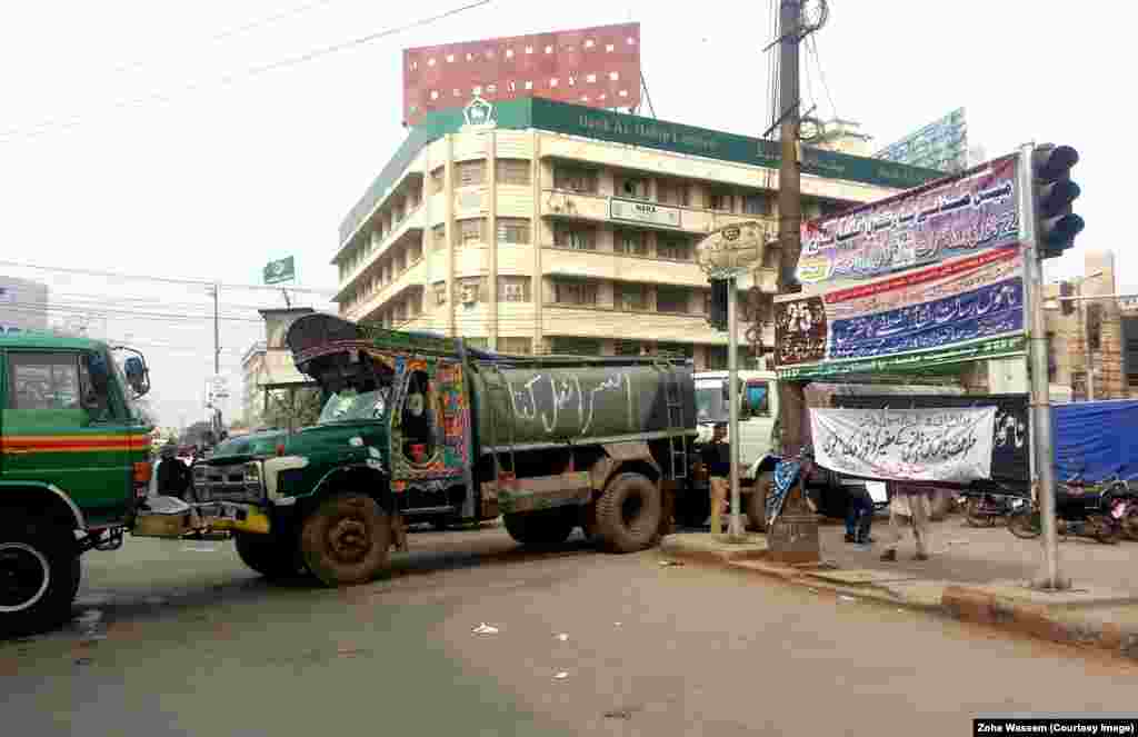 Water tankers block roads in Karachi while an anti-Western demonstration is held in January.