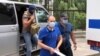 A resident of Simferopol is is brought to court to face espionage charges on June 24.