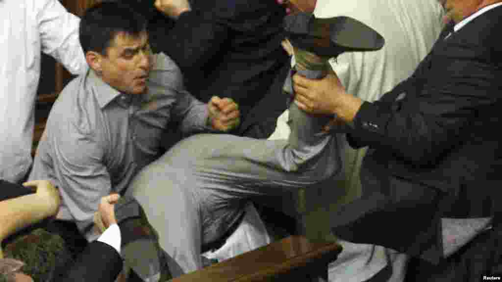 Deputies scuffle during a session in the lower chamber of the Ukrainian parliament in Kyiv on May 24. (Reuters)