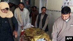 Pakistani relatives push a stretcher carrying the body of a victim at a hospital following cross border clashes between Afghan and Pakistani forces on May 5.