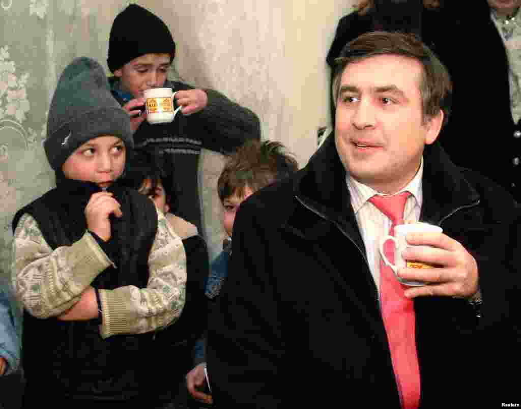 President Mikheil Saakashvili visits an orphanage in Tbilisi on January 23, 2006.