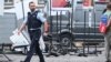 Police officers work at the scene where several people were injured in a knife attack on May 31 in Mannheim, Germany.