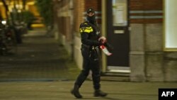 A policeman stands near the location in Rotterdam where a 32-year-old Frenchman was arrested at the request of French authorities over suspicions of his involvement in a terror operation.