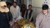 Pakistani relatives push a stretcher carrying the body of a victim at a hospital following cross border clashes between Afghan and Pakistani forces on May 5.