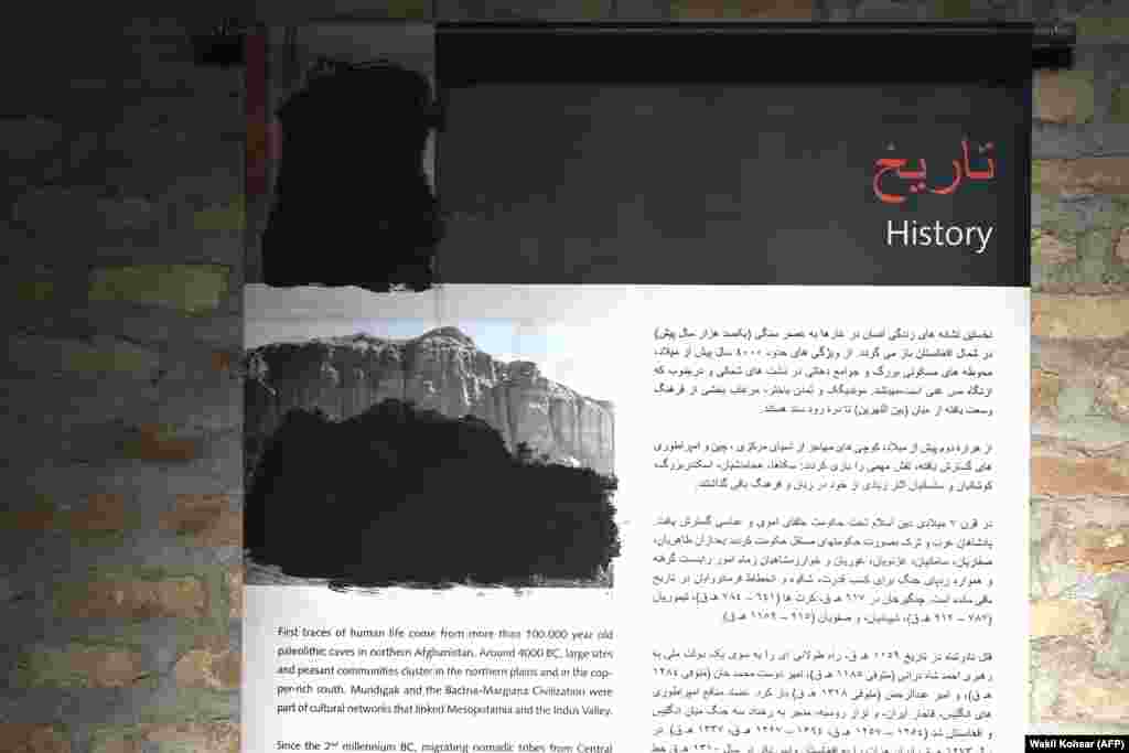 A photo taken on January 7 in a museum in the western Afghan city of Herat shows a display that depicted the Buddhas of Bamiyan. The historic photo has been censored with black paint.A “morality law” banning photographs and video of “animate beings” was first approved by Taliban leadership in August 2024 but the impact of the ban has been felt only gradually, and it has not been enforced in every Afghan region.