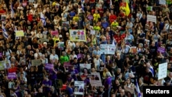 People demonstrate against the government and to show support for the hostages taken during the deadly October 7, 2023, attack by Hamas in Tel Aviv on October 12.