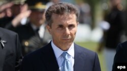 Georgian Prime Minister Bidzina Ivanishvili attends a wreath-laying ceremony at a cemetery in Tbilisi on August 8.