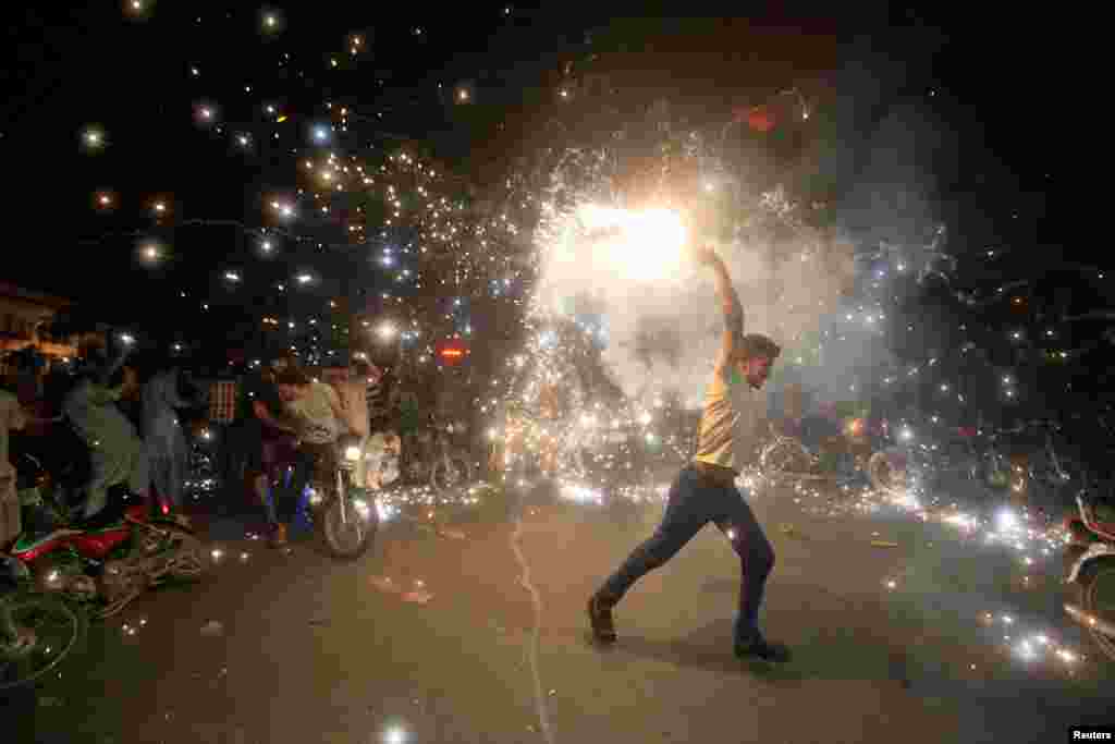 Pakistani cricket fans cheer after Pakistan defeated India in the Champions Trophy finals in Lahore on June 18. 