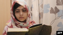 Malala Yousafzai reading at the Queen Elizabeth Hospital in Birmingham.