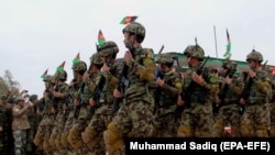 Afghan Army soldiers march at a ceremony to mark Soldiers Day in Kandahar on February 28, 2018.