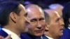 Russian President Vladimir Putin (center) is flanked by Sergei Naryshkin (left), head of the Russian Foreign Intelligence Service, and Federal Security Service Director Aleksandr Bortnikov at a meeting with intelligence officers in Moscow in December. 