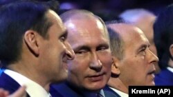 Russian President Vladimir Putin (center) is flanked by Sergei Naryshkin (left), head of the Russian Foreign Intelligence Service, and Federal Security Service Director Aleksandr Bortnikov at a meeting with intelligence officers in Moscow in December. 