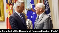 Kosovo President Hashim Thaci (left) is received at the White House by U.S. Vice President Mike Pence in Washington, D.C., on September 29.