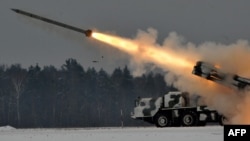 Belarus -- An army Smerch (Tornado), Soviet-made heavy multiple rocket launcher, fires during exercises in the Brest region, 25Jan2011