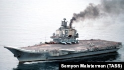 The eight-vessel Russian flotilla is being led by the aircraft carrier Admiral Kuznetsov (pictured, file photo). 