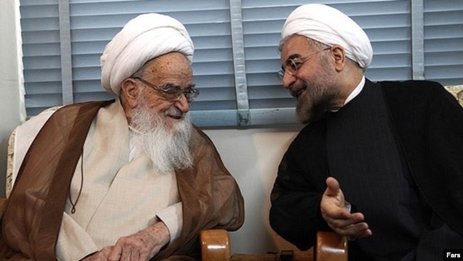 Iranian President Hassan Rouhani (R) meeting Grand Ayatollah Safi Golpaygani, July 2013