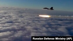 RUSSIA -- An Su-30 fighter jet of the Russian air force launches a missile during maneuvers in southern Russia, September 27, 2018