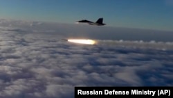 RUSSIA -- An Su-30 fighter jet of the Russian air force launches a missile during maneuvers in southern Russia, September 27, 2018
