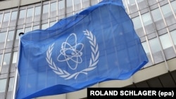 A file photo dated 07 October 2005 shows the flag of the International Atomic Energy Agency (IAEA) waving in front of the organosation's headquarters in the Uno-City in Vienna, Austria.