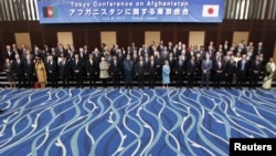 Japan -- Delegates pose at a photo session at the Tokyo Conference on the Reconstruction of Afghanistan, in Tokyo, 08Jul2012