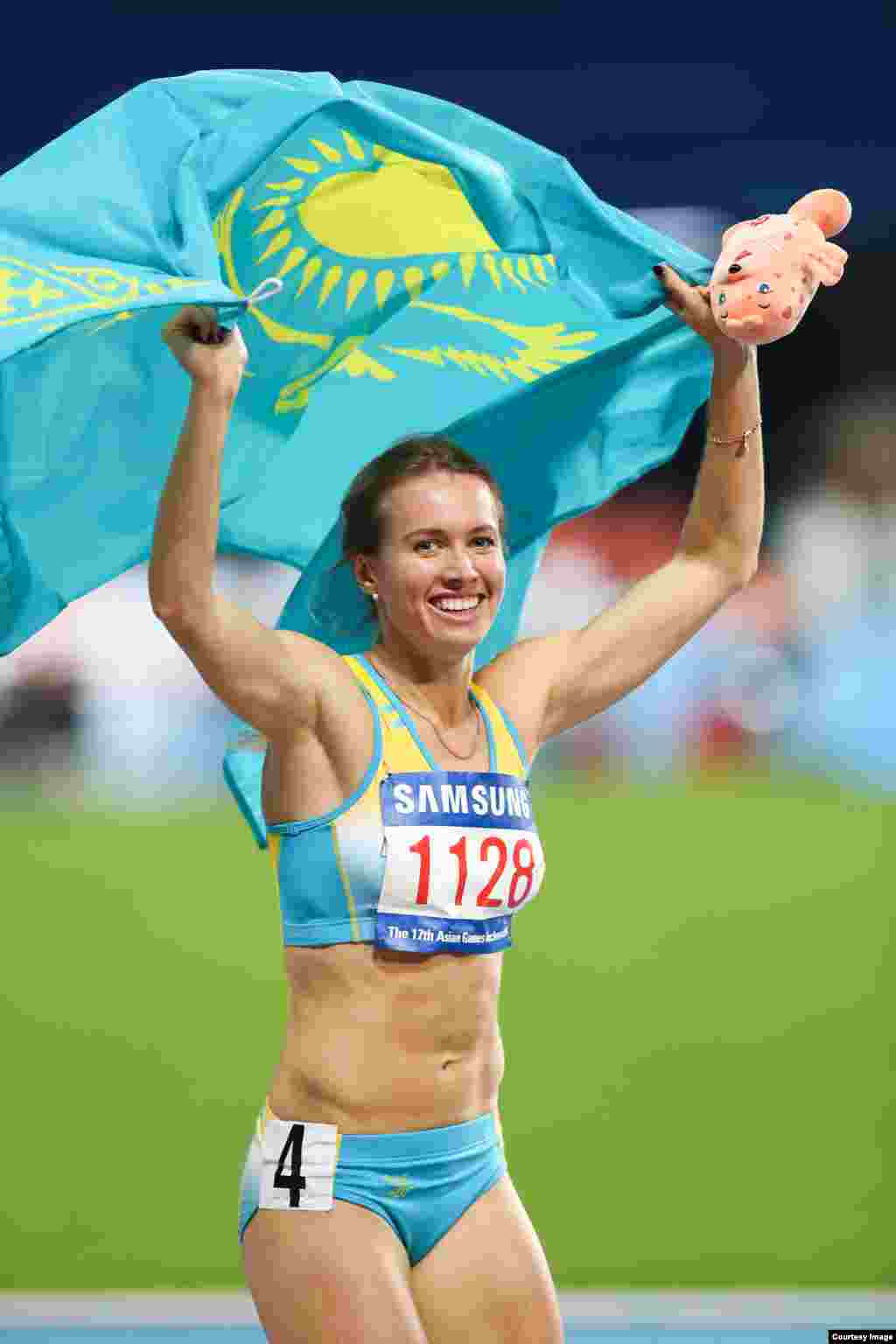 Казахстанская легкоатлетка Ольга Сафронова стала чемпионкой в беге на 200 метров. Инчхон, 1 октября 2014 года. Фото Никиты Басова.